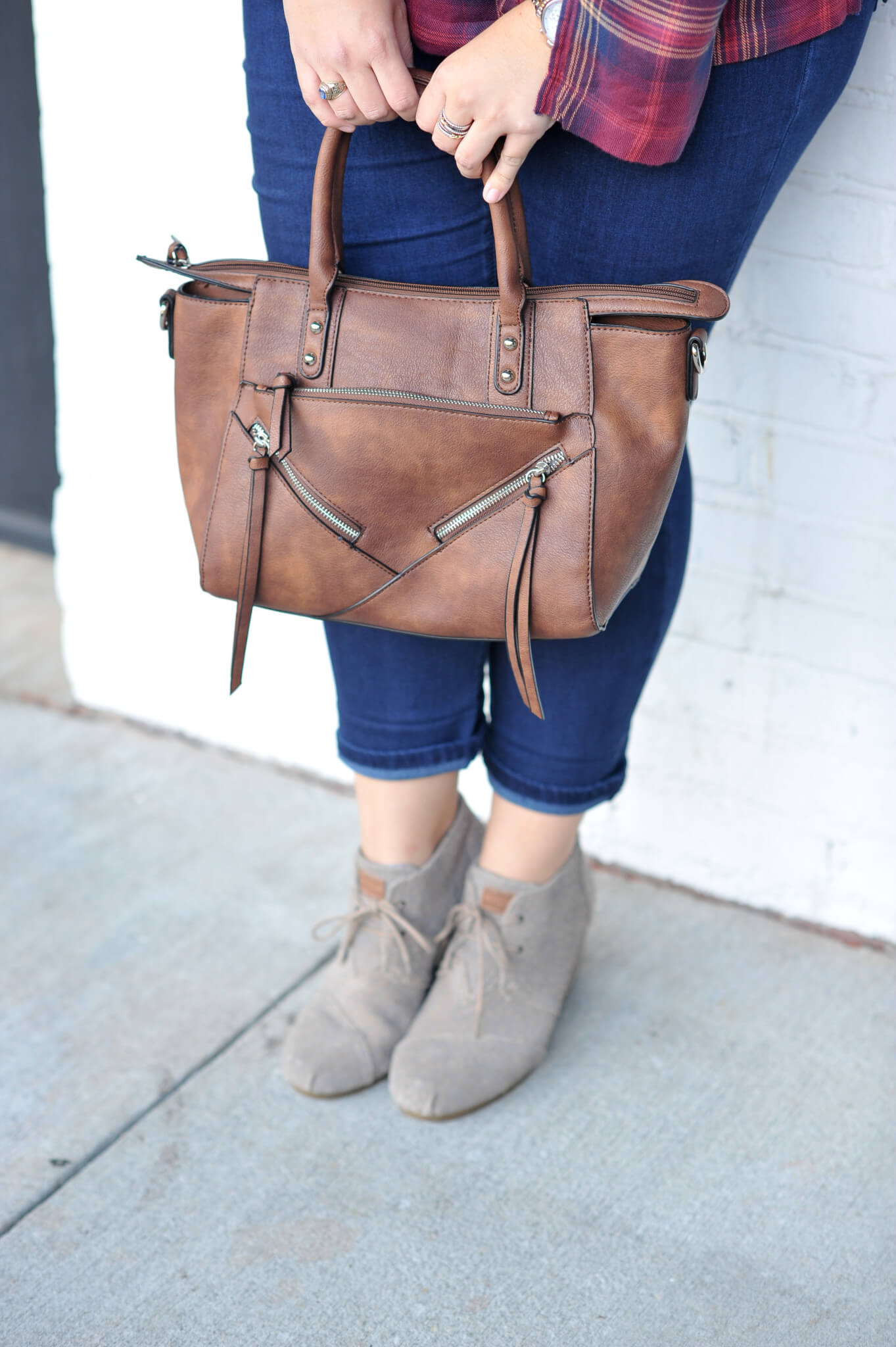 Emily Bastedo from the curvy style blog, Something Gold, Something Blue shares a great fall transition outfit with this adorable off the shoulder plaid top from Anthropolgie, a pair of skinny jeans, Toms wedges and a gorgeous bag from Pinkstix.