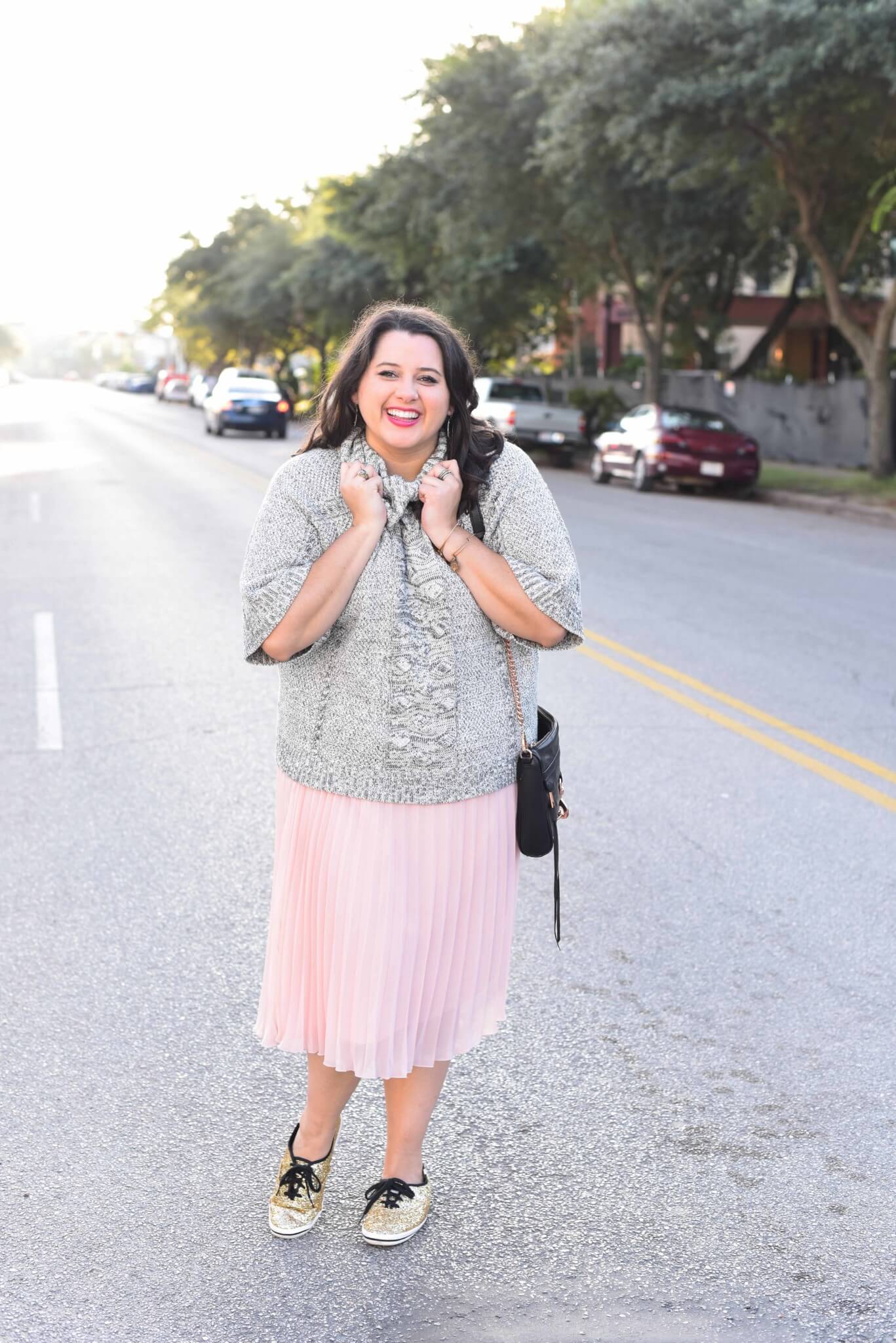 Being cozy this time of year is essential. Emily Bastedo from the curvy style blog, Something Gold, Something Blue is sharing her take on the perfect brunch outfit with a grey oversized turtleneck from Anthroplogie, a soft pink pleated skirt, giltter Kate Spade Keds and a few cute accessories.