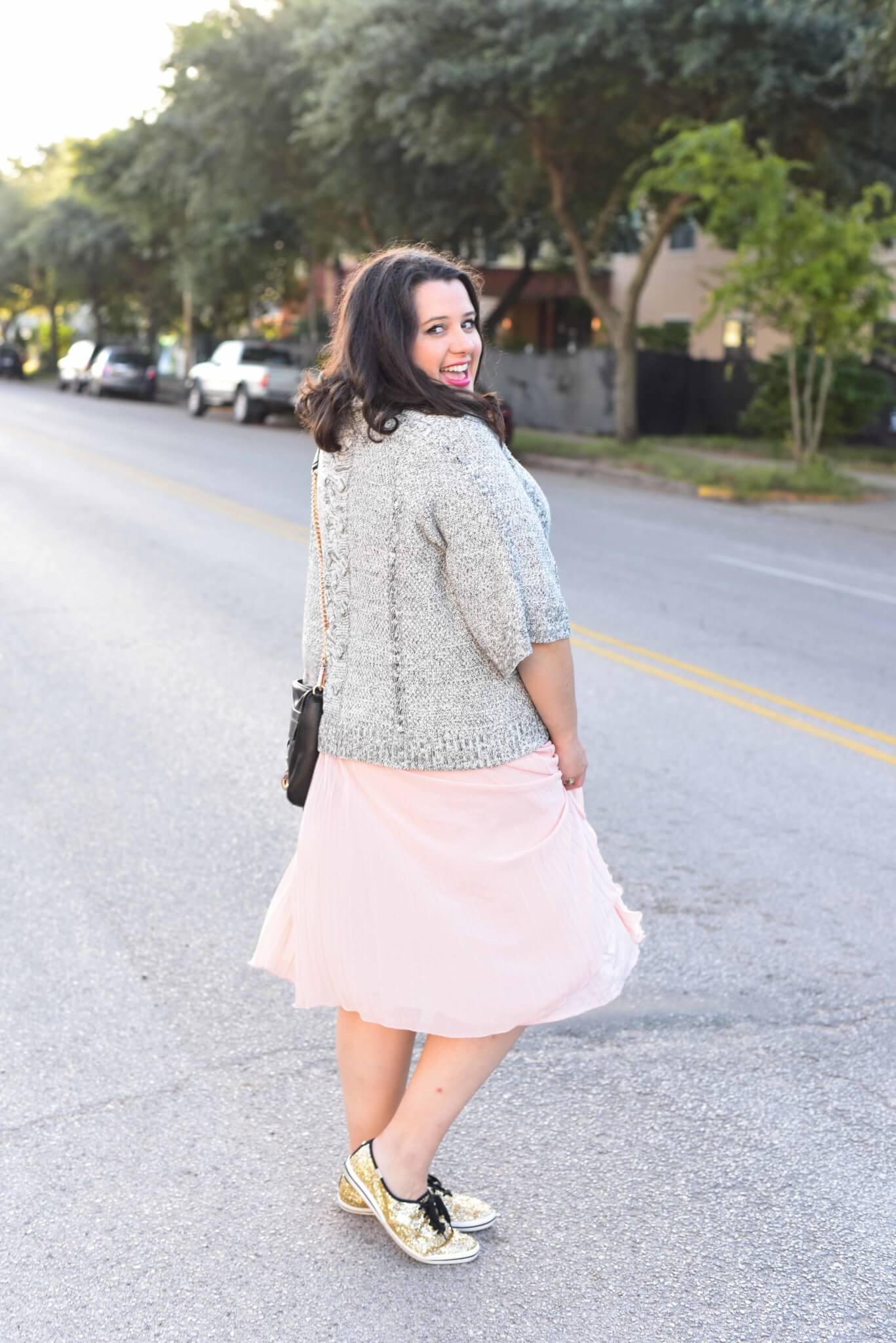Being cozy this time of year is essential. Emily Bastedo from the curvy style blog, Something Gold, Something Blue is sharing her take on the perfect brunch outfit with a grey oversized turtleneck from Anthroplogie, a soft pink pleated skirt, giltter Kate Spade Keds and a few cute accessories. 