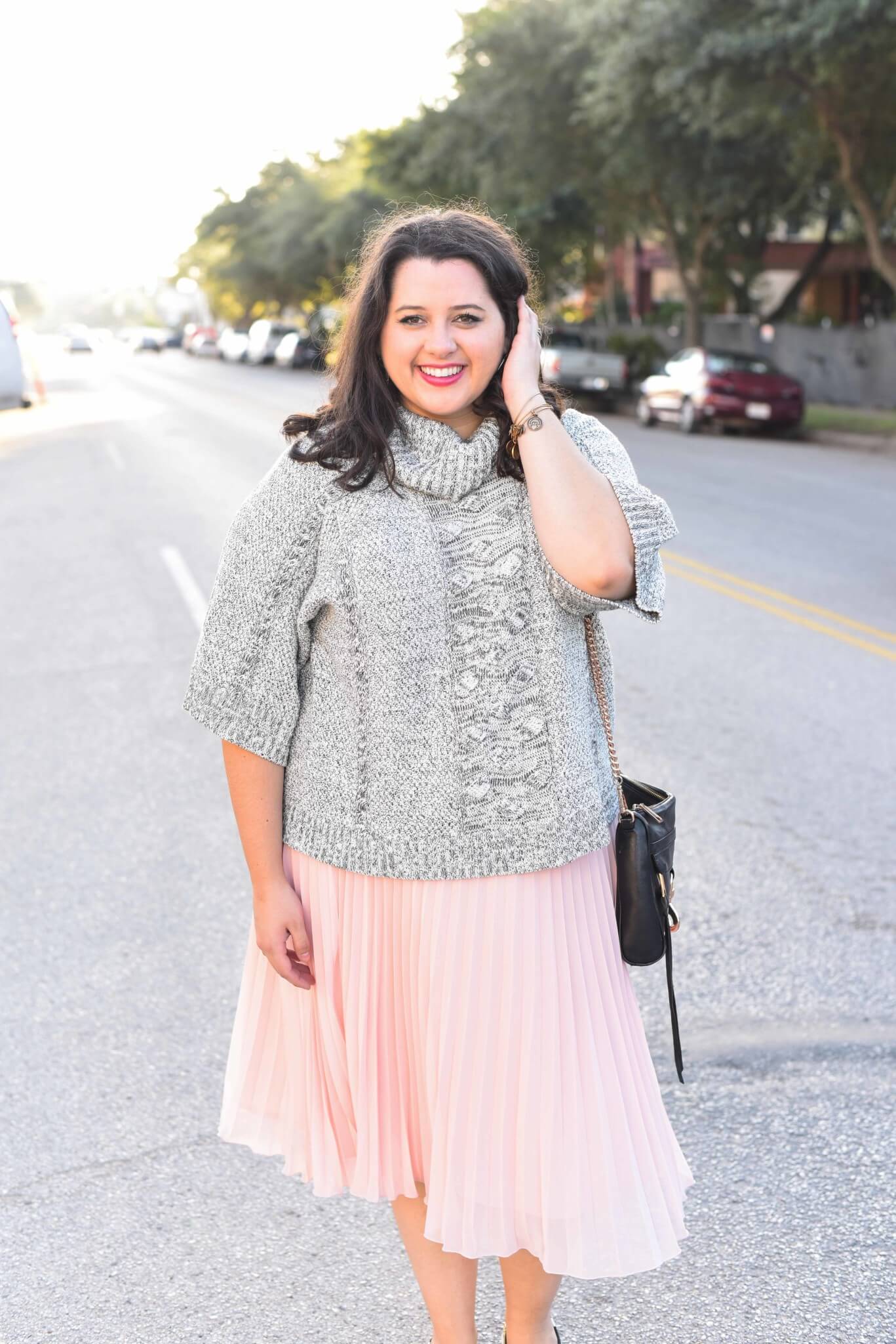 Being cozy this time of year is essential. Emily Bastedo from the curvy style blog, Something Gold, Something Blue is sharing her take on the perfect brunch outfit with a grey oversized turtleneck from Anthroplogie, a soft pink pleated skirt, giltter Kate Spade Keds and a few cute accessories. 