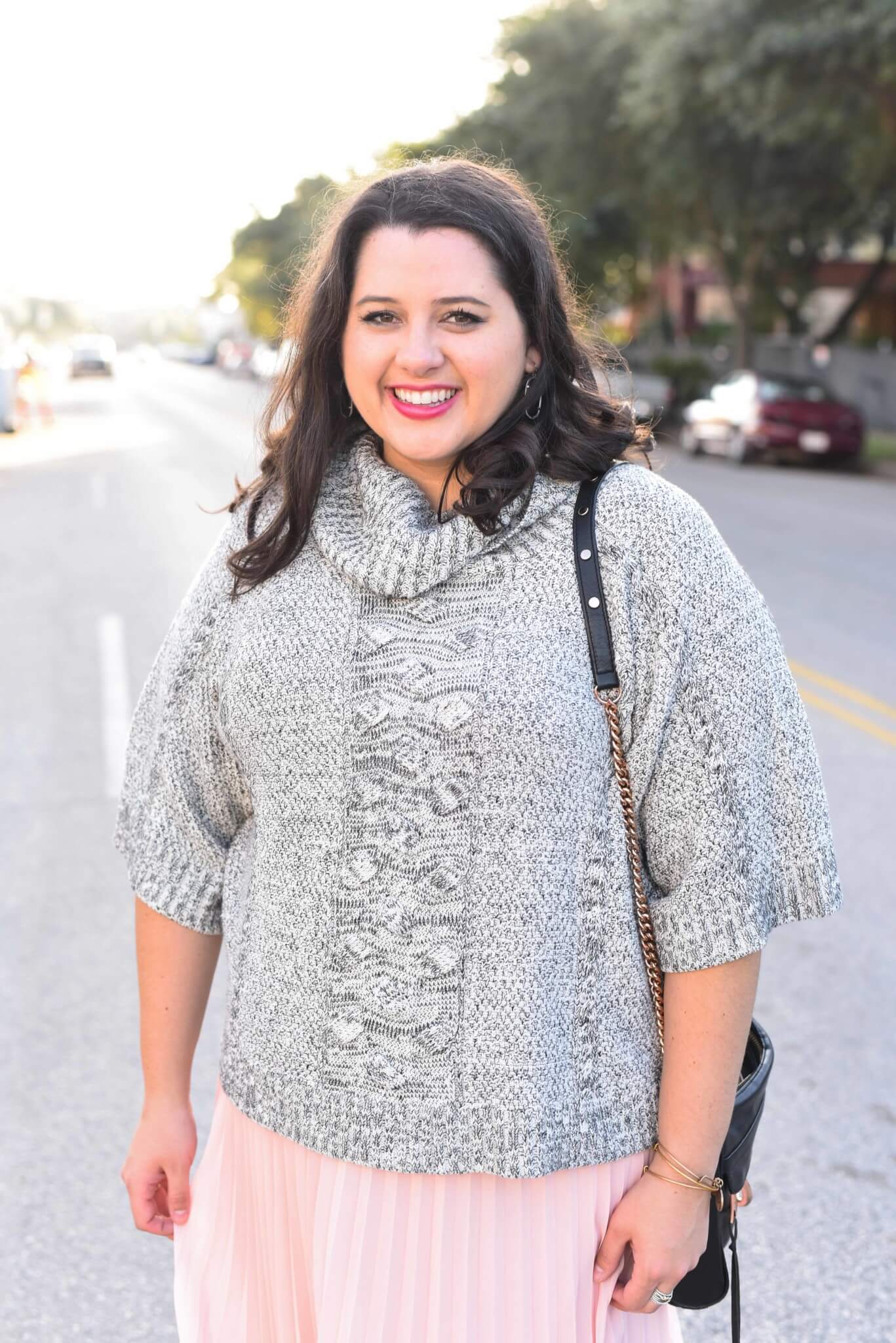 Being cozy this time of year is essential. Emily Bastedo from the curvy style blog, Something Gold, Something Blue is sharing her take on the perfect brunch outfit with a grey oversized turtleneck from Anthroplogie, a soft pink pleated skirt, giltter Kate Spade Keds and a few cute accessories. - Work with popular Houston fashion blogger, Something Gold, Something Blue