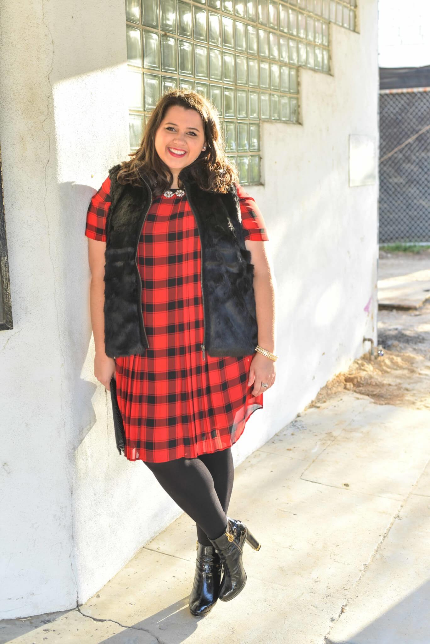 The holidays can be stressful, but having a casual holiday party look planned out and ready to go is one way to help simplify your to do list. This red buffalo plaid shirt dress and black faux fur vest from Foxcroft make the perfect combination with some glamourous jewlery. - @EmilySGSB - Curvy Style Blogger from Something Gold, Something Blue