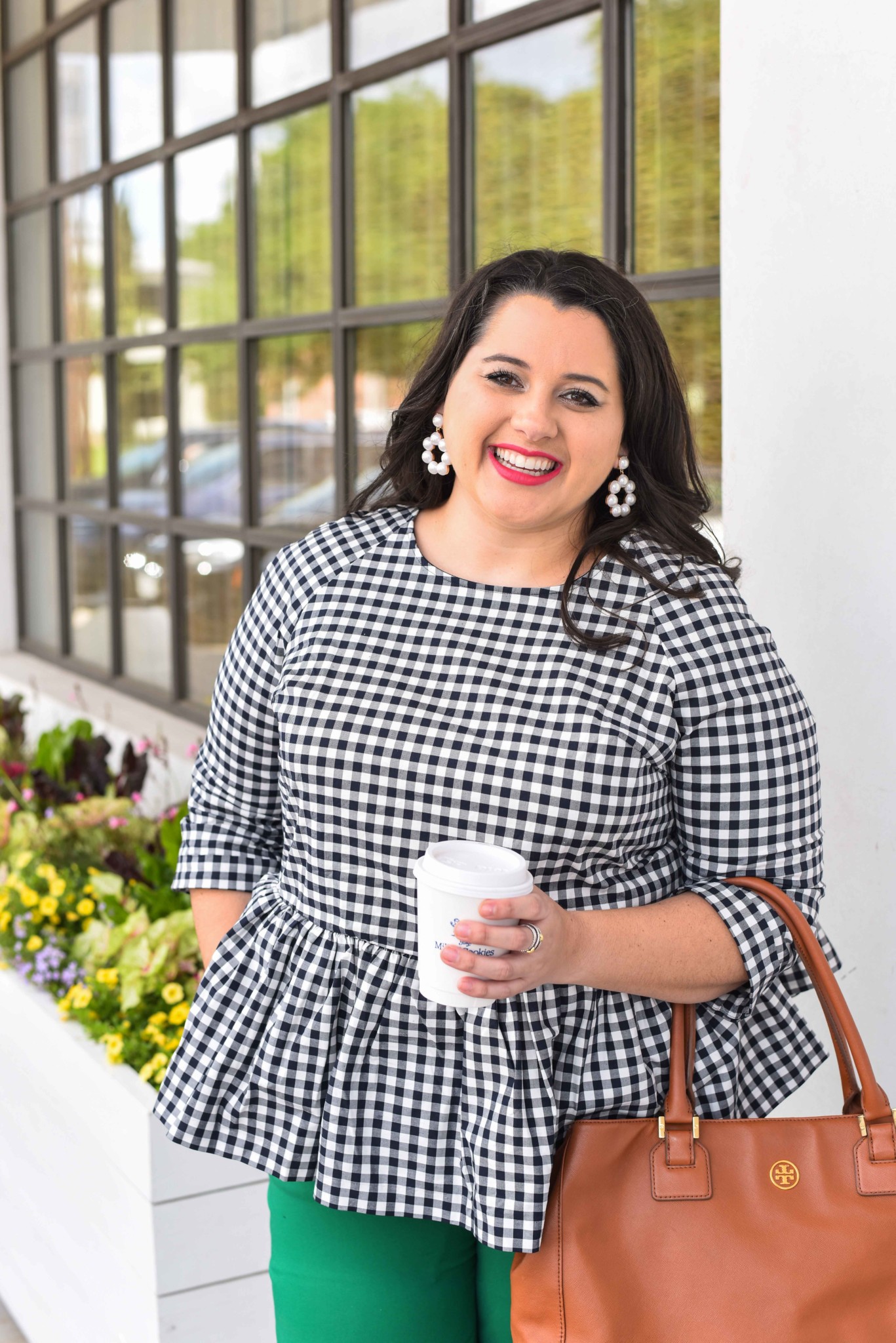Traveling can be stressful, especially when your flight is delayed or even worse, cancelled. In today’s blog post, I’m sharing a few travel delay tips that will help you make the best of the situation. I’m also talking about wearing a quintessential preppy item, a gingham peplum top. Emily Bastedo from the curvy style blog, Something Gold, Something Blue, is sharing how she is styling this gorgeous spring top perfect for both work and happy hour. Plus size, curvy, fashion, style, travel tips. - Work with popular Houston fashion blogger, Something Gold, Something Blue