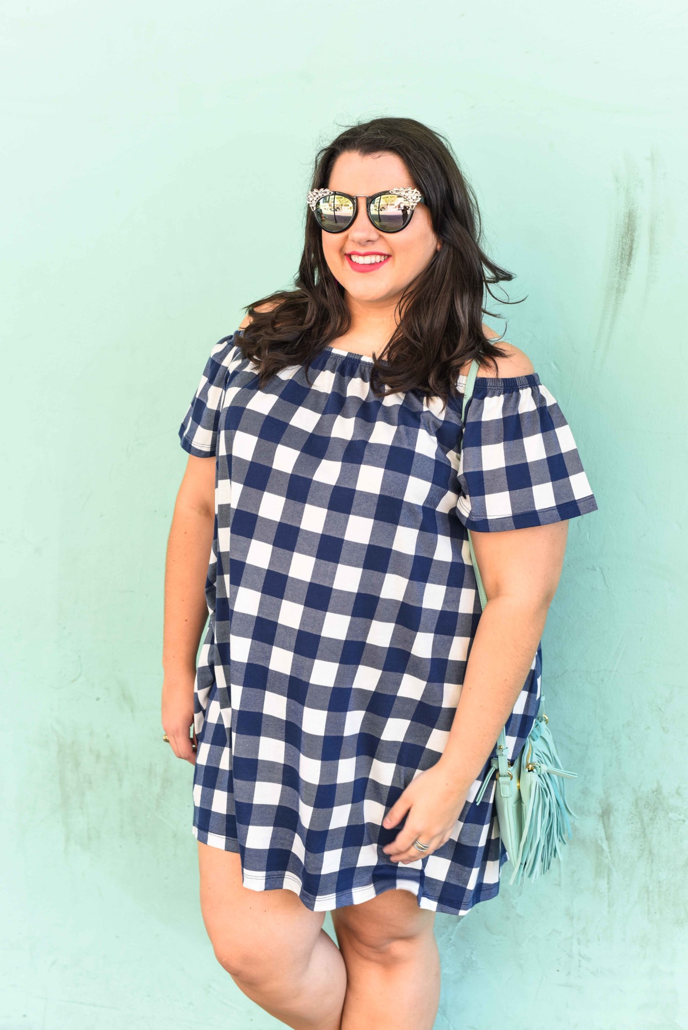 A gingham off the shoulder dress is a perfect way to kick off the summer. This preppy off the shoulder dress is perfect for anyone who wants to look chic while being comfortable. Plus size style blogger, Emily Bastedo from Something Gold, Something Blue shares how she would style this blue gingham off the shoulder dress for a weekend casual look.