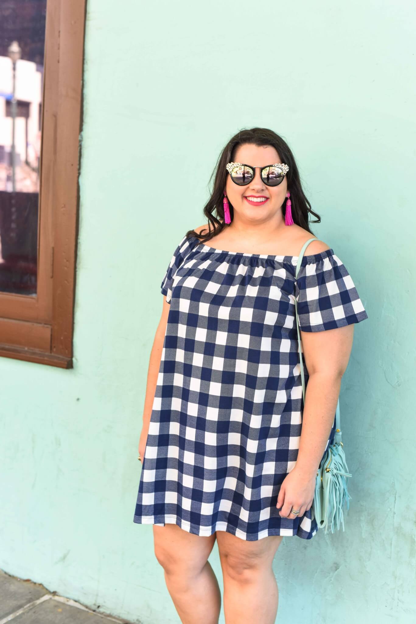 A gingham off the shoulder dress is a perfect way to kick off the summer. This preppy off the shoulder dress is perfect for anyone who wants to look chic while being comfortable. Plus size style blogger, Emily Bastedo from Something Gold, Something Blue shares how she would style this blue gingham off the shoulder dress for a weekend casual look.