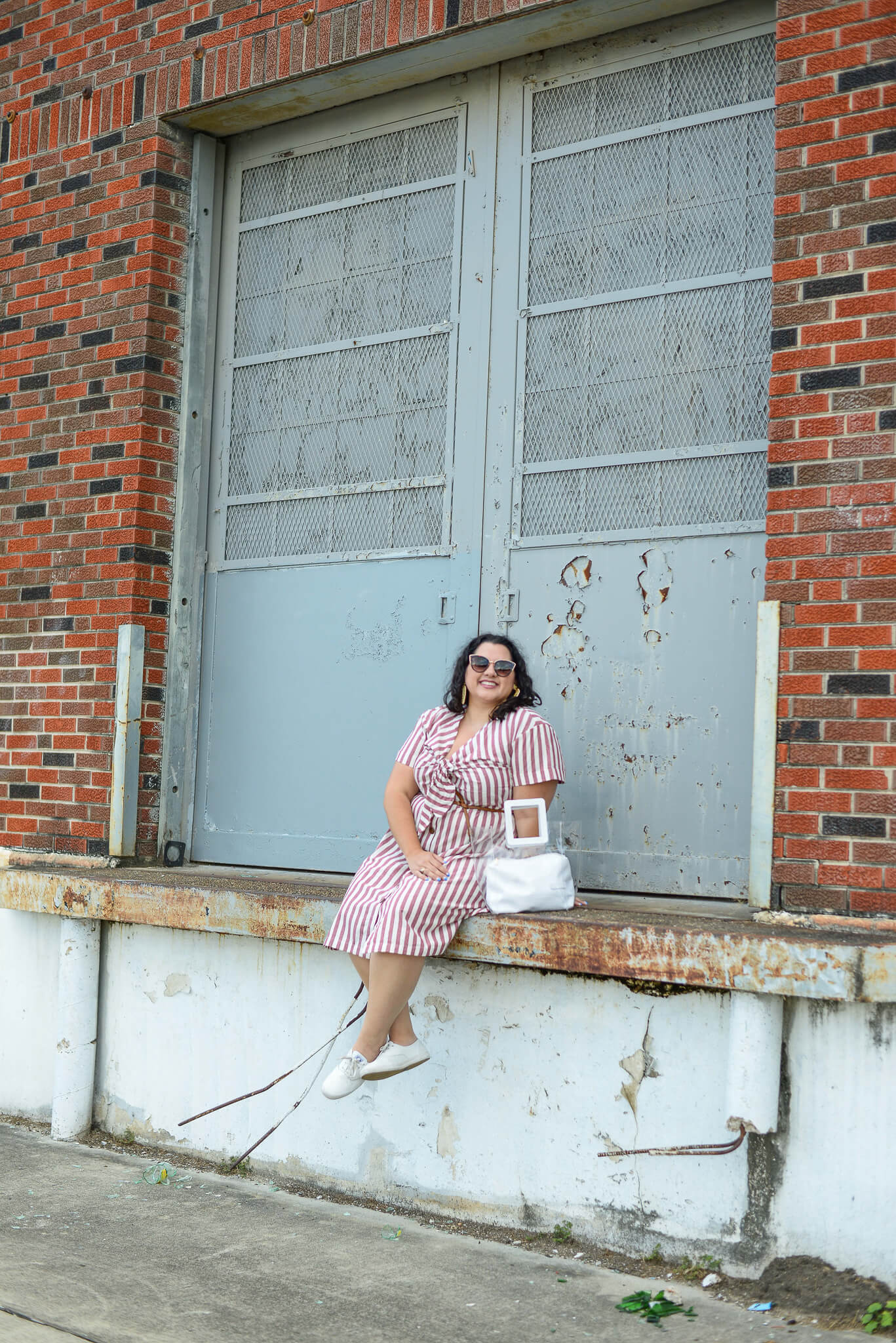 Avoiding the Texas summer heat by wearing this linen striped dress from Eloquii