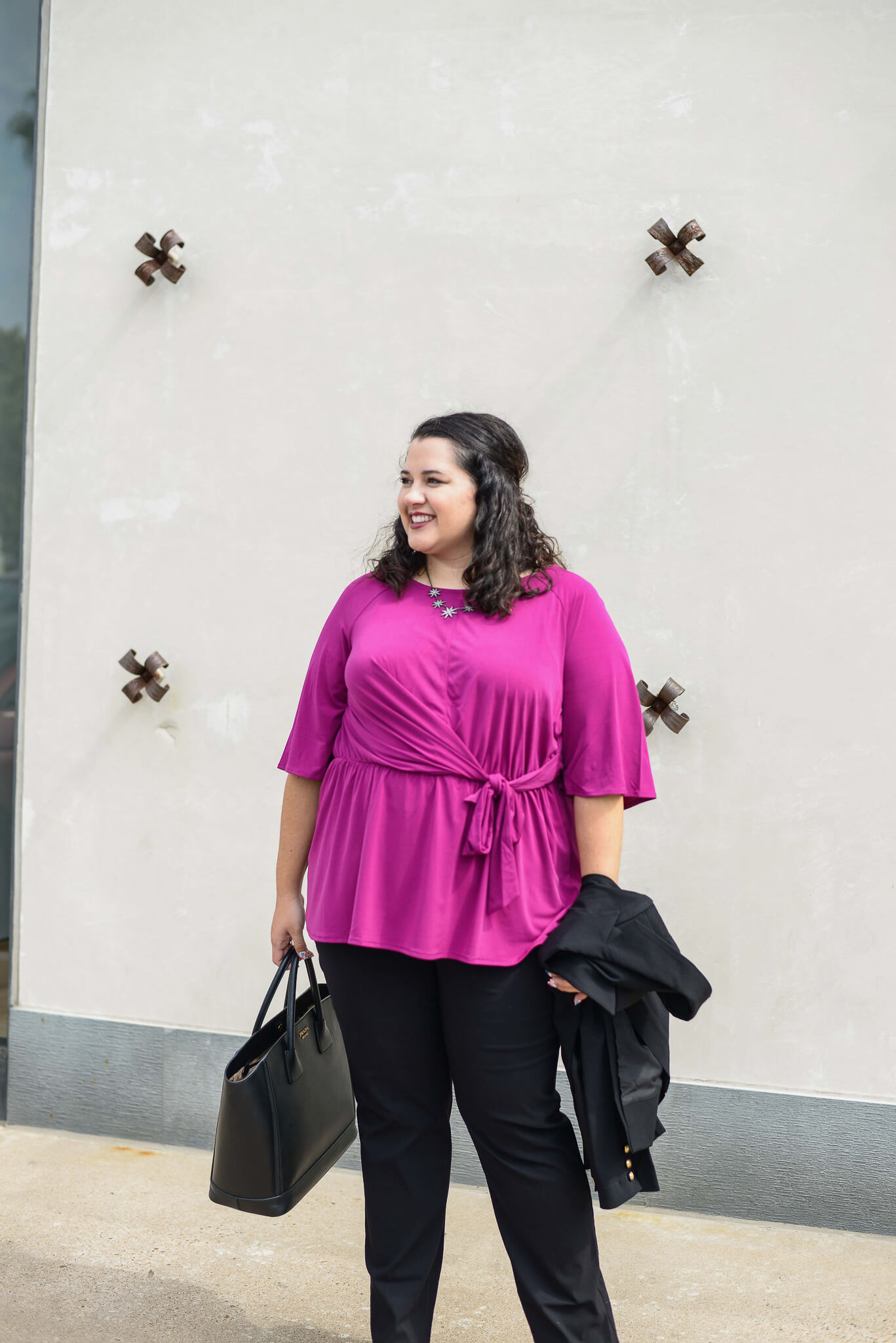 I love pairing a bright colored top with a neutral suit for the perfect plus size business casual outfit. 