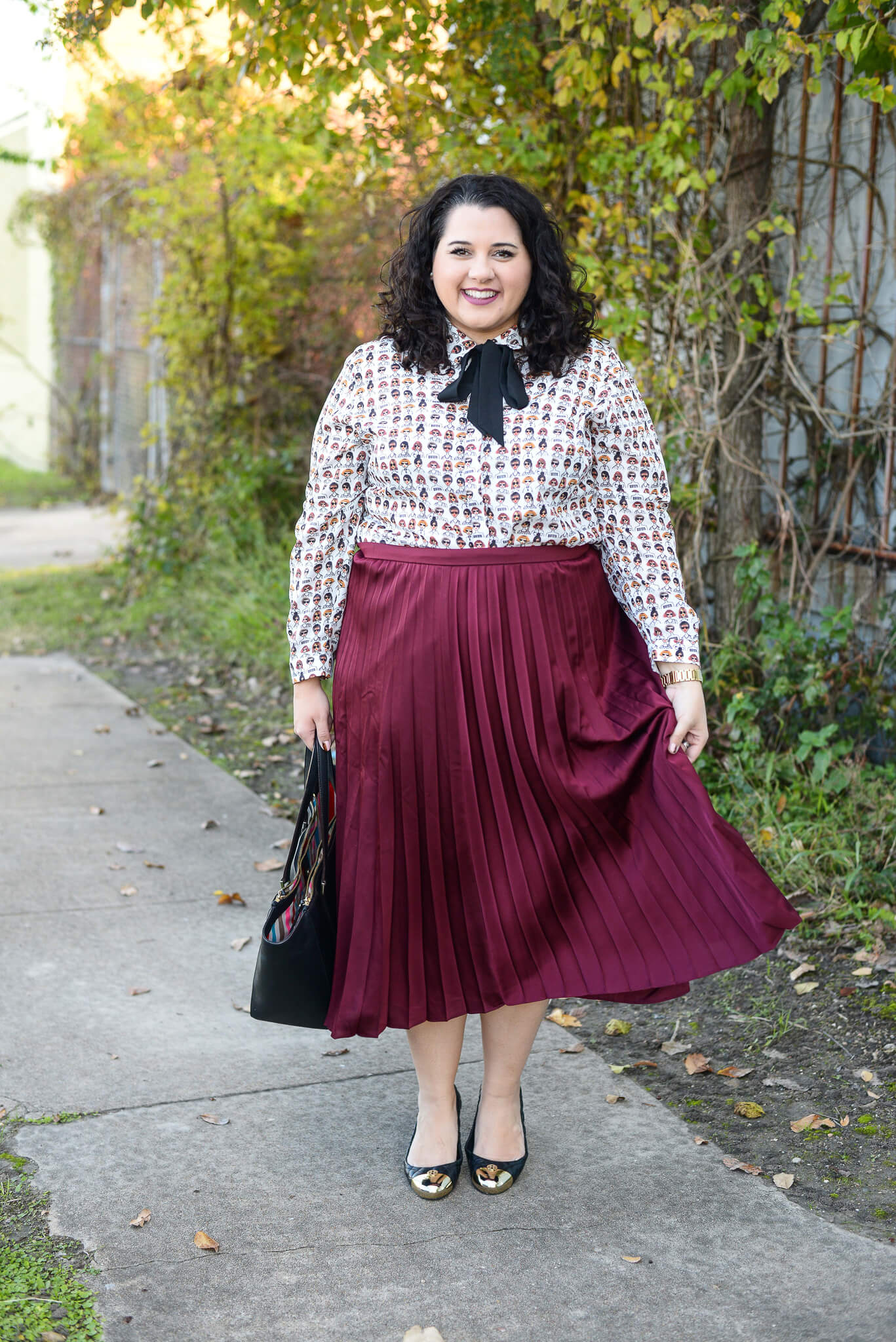 Finding a style at work can be difficult sometimes but a good colorful basic, like this pleated maroon skirt is a staple in every career woman's wardrobe. 