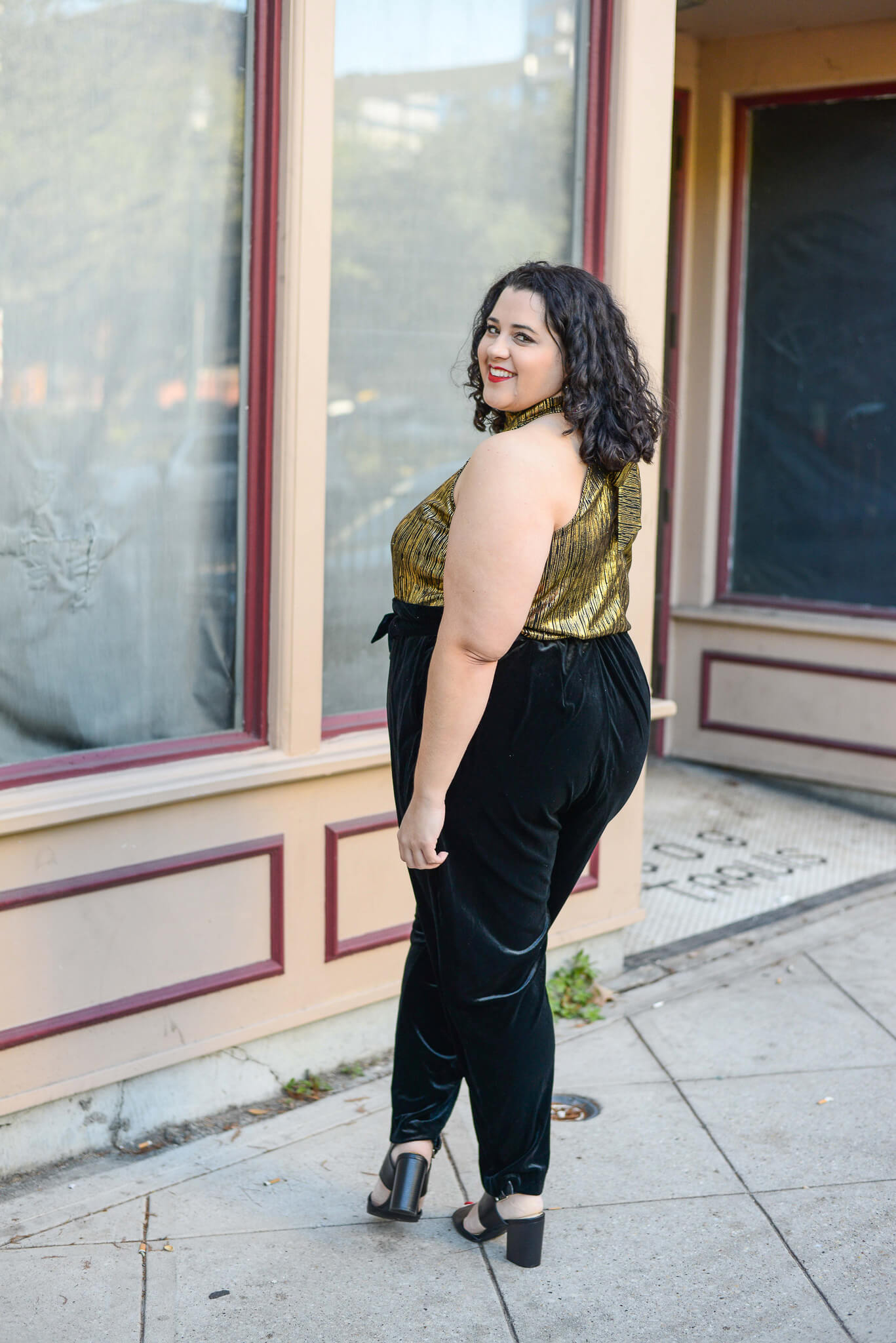 A velvet pair of pants paired with a metallic halter top makes for the perfect plus size NYE outfit